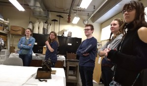Students in a museum storage room.